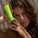 Model is holding Superfood hand therapy in her hands. The product is in a green tube with white writing. It contains olive squalane, papaya & oat milk.